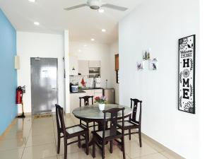 a kitchen and dining room with a table and chairs at PuchongIsland WindyStay3R2B8Pax AT D'Island in Puchong