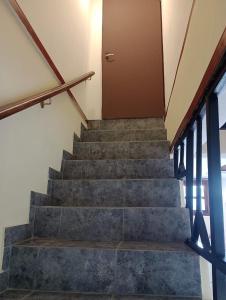 a set of stairs in a house with a door at Depto Tobas in Ushuaia