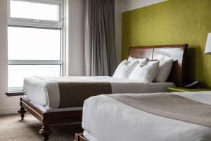 Postel nebo postele na pokoji v ubytování Hotel Champlain