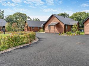 a row of houses with a driveway in front at 2 Bed in Gower 91728 