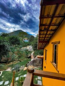 a balcony of a house with a view of a mountain at Segredo da alma in Sana