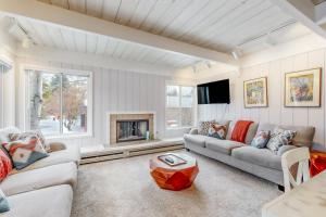 a living room with two couches and a fireplace at New Village Center in Sun Valley