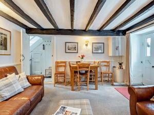 a living room with a couch and a table at 3 Bed in Hawkshead Village LLH39 in Hawkshead