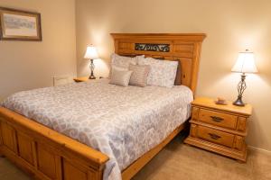 a bedroom with a large bed and two night stands at Grisham's View Condo: Central Condo with a Golf Course View! in Ruidoso
