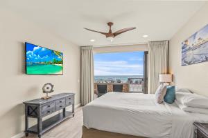 a bedroom with a bed and a large window at Oceanside Escape in Oceanside