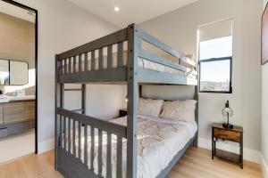 a bedroom with a bunk bed and a bathroom at Brand New 9 Modern Bedroom Compound in Pickfair Village in Los Angeles