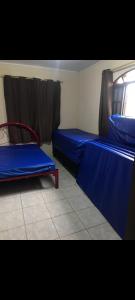 Ένα ή περισσότερα κρεβάτια σε δωμάτιο στο Chácara em Biritiba Mirim
