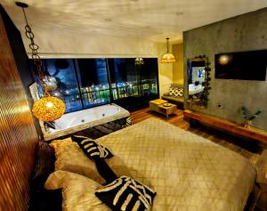 Postel nebo postele na pokoji v ubytování Habitacion Deluxe 2 con Jacuzzi a 20 mt del parque