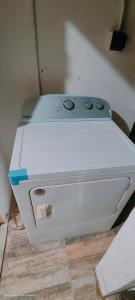 a white appliance sitting on top of a counter at Arrive and Stay in Dabadie