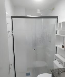 a glass shower door in a bathroom with a toilet at Edificio multishopping centro do Nucleo Bandeirante in Núcleo Bandeirante