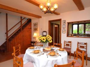 a dining room with a white table and chairs at 3 Bed in Dulverton RDOOR in Exton