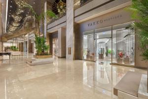 a shopping mall with potted plants in it at Cullinan Belek in Belek +124 photos