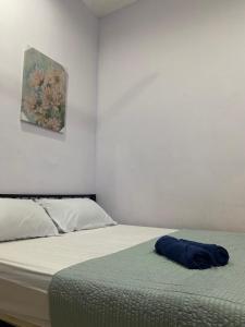 Säng eller sängar i ett rum på Homestay Desa Tikam batu