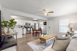 a living room with a couch and a table at Historic Gillespie Getaway in Sarasota