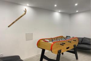 a table with a chessboard on it in a room at Lovely duplex with cinema room in Le Dévoluy