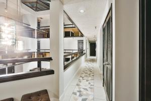 a hallway of a house with white walls at Hotel International in Lynnwood