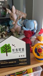 a group of stuffed animals sitting on a shelf at Happy Together B&B in Wujie