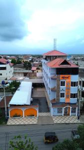 an overhead view of a city with a building at Hotel SMIR in Huaquillas