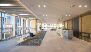 an office with a lobby with large windows at Grab The Ocean Songdo in Busan