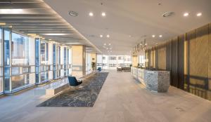 an office with a lobby with large windows at Grab The Ocean Songdo in Busan