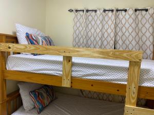 a bunk bed in a room with two bunk beds at Cozy & comfy house in La Chorrera