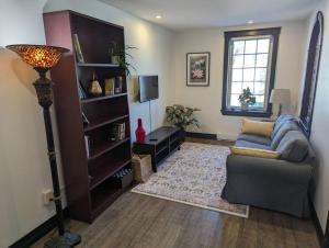 a living room with a couch and a television at Beautiful River View Apt in Wine Country in Canning