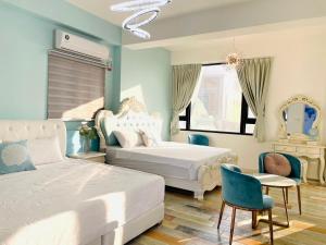 Letto o letti in una camera di 澎湖卡米諾民宿ll住宿接駁ll貓店長