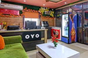 a restaurant with an ovo sign on the wall at OYO Shibani & Suhani in Bārang