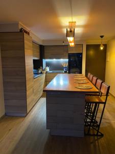 a kitchen with a large island in the middle at The Roses in Puerto Varas