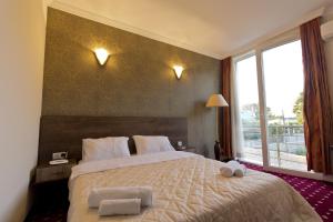 Voodi või voodid majutusasutuse Orange Hotel toas