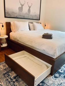 a bedroom with a large bed with a large drawer at Pet-Friendly Space #3 at Doggy Digs, King Bed and Office in Halifax