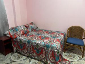 a couch and a chair in a room at Estuary Apartments 1 in Dunfermline