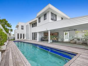 an exterior view of a house with a swimming pool at Coastal Luxe - 200m to the Beach plus Pool in Kingscliff