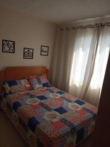 En eller flere senge i et værelse på Apartamento locação diária - residencial Belize