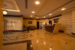 a lobby with a staircase in a building at ريف الشرقية للشقق الفندقية in Dammam
