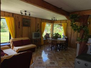 a living room with a couch and a table at Valle Hermoso in Panguipulli