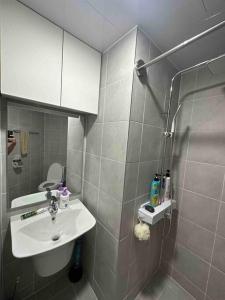 a bathroom with a sink and a shower at Newly Renovated House in Yatap-dong in Seongnam