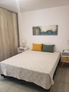 a bedroom with a large bed in a room at ALTOS DE ALEM in Alta Gracia
