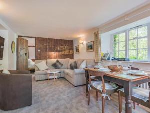 a living room with a couch and a table at 2 Bed in Patterdale SZ210 in Patterdale