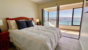 En eller flere senge i et værelse på Lo Mejor Viña del Mar