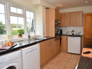 a kitchen with a sink and a dishwasher at 3 Bed in Smarden 58544 in Smarden