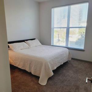 a bedroom with a bed and a large window at Downtown Dream Toyota Ctr/George R Brown/Minute Maid Stadium in Houston