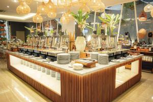 Restoranas ar kita vieta pavalgyti apgyvendinimo įstaigoje Hotel FortunaGrande Malioboro Yogyakarta