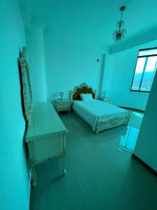 Un pat sau paturi într-o cameră la Hermoso PH con parrillera
