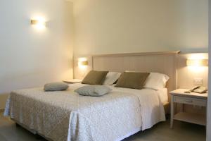 Кровать или кровати в номере Hotel Marana
