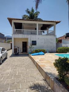 Πισίνα στο ή κοντά στο Casa confortável com piscina