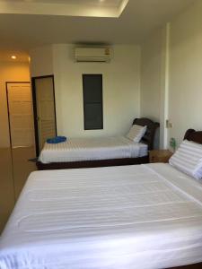 Postel nebo postele na pokoji v ubytování Relaxation guesthouse