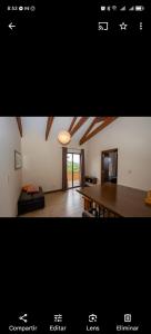 a picture of a living room with a dining room table at Degustar Restaurante Hotel Boutique in Tinquipaya