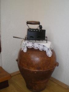a suitcase sitting on top of a vase at Apartment Vidovići in Martinšćica