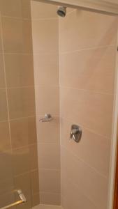 a shower with a glass door in a bathroom at Apt Bedroom Apartment era With Doorman in Bucaramanga +22 photos